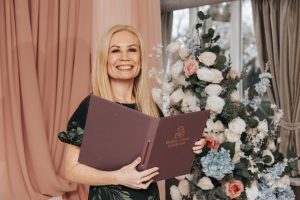 Emma Green Celebrant holding a ceremony folder