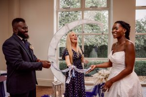 Emma Green celebrant laughing at a handfasting ritual