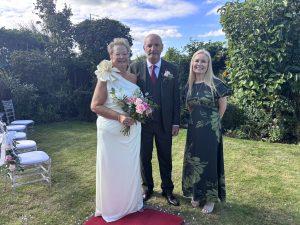 Emma Green celebrant with a couple at an outdoor wedding