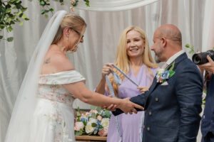 Emma Green Celebrant doing a handfasting ceremony at a wedding